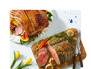 Image of ham and roast on caving board.