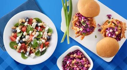 Salad with strawberries, blueberries, feta and mint. Barbecue pulled pork sandwiches with purple cabbage slaw.