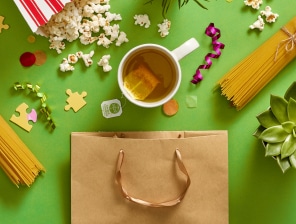 popcorn, spaghetti, hot tea, puzzle pieces and plans all spilled out of gift bag