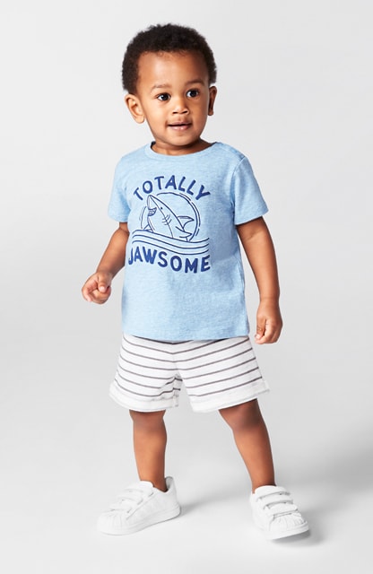 toddler in graphic tee and knit shorts