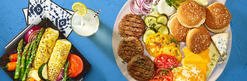 Delicious grilled food with drinks and napkins.